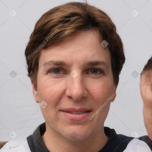 Joyful white adult female with short  brown hair and grey eyes