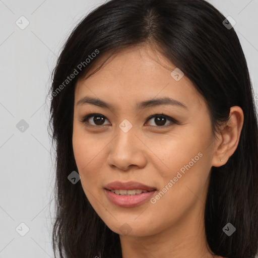 Joyful asian young-adult female with long  brown hair and brown eyes