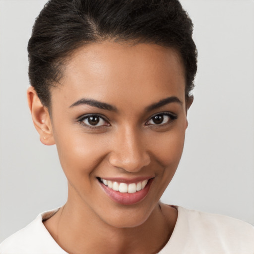 Joyful latino young-adult female with short  brown hair and brown eyes