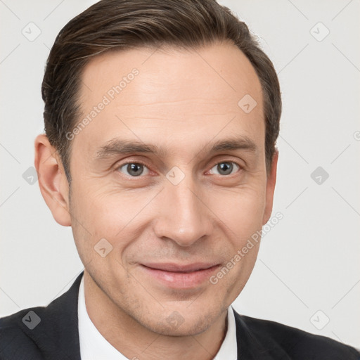 Joyful white adult male with short  brown hair and grey eyes