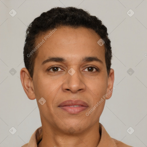 Joyful latino young-adult male with short  brown hair and brown eyes