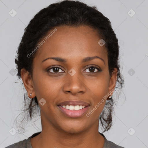 Joyful black young-adult female with long  brown hair and brown eyes