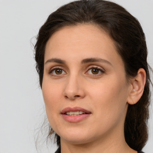 Joyful white young-adult female with medium  brown hair and brown eyes