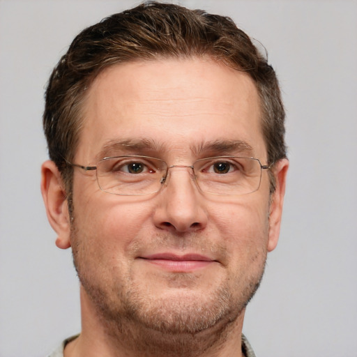 Joyful white adult male with short  brown hair and grey eyes