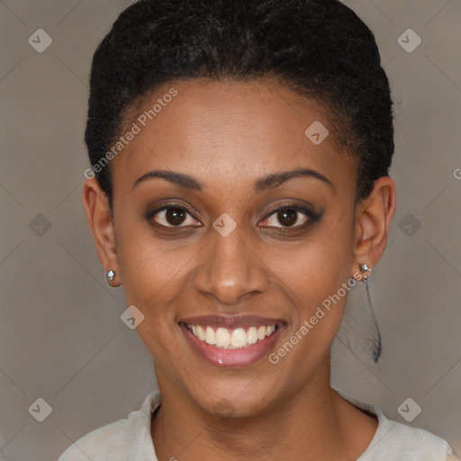 Joyful black young-adult female with short  brown hair and brown eyes