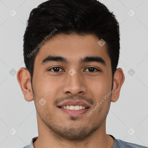 Joyful latino young-adult male with short  brown hair and brown eyes