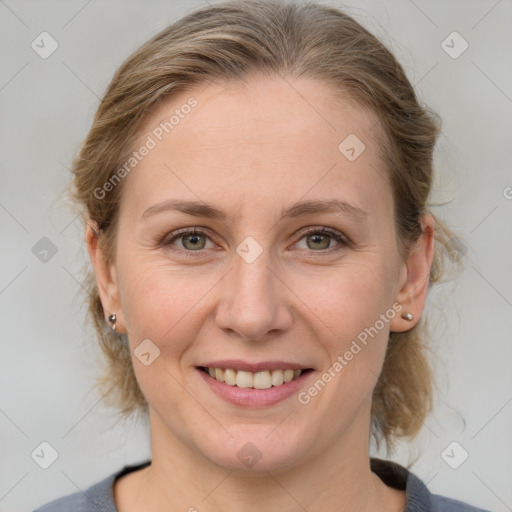 Joyful white adult female with medium  brown hair and grey eyes