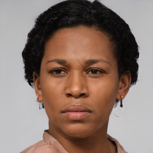 Neutral latino young-adult female with short  black hair and brown eyes