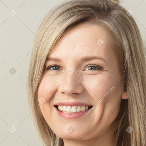 Joyful white young-adult female with long  brown hair and grey eyes