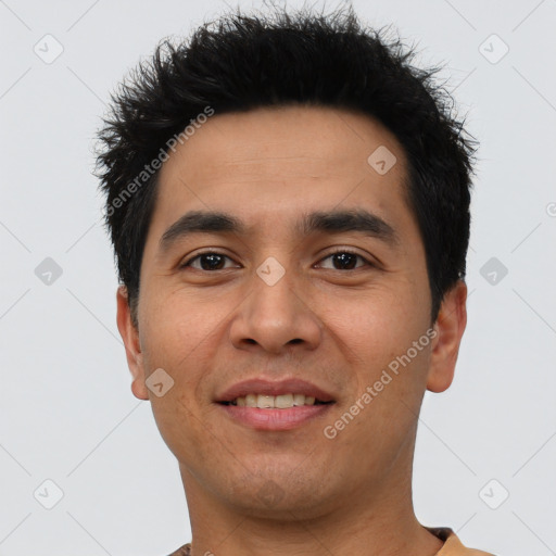 Joyful asian young-adult male with short  black hair and brown eyes