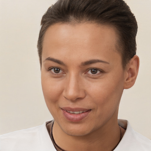 Joyful white young-adult female with short  brown hair and brown eyes