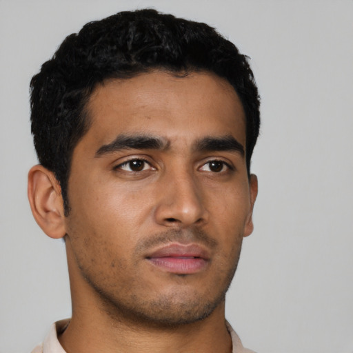 Neutral latino young-adult male with short  black hair and brown eyes