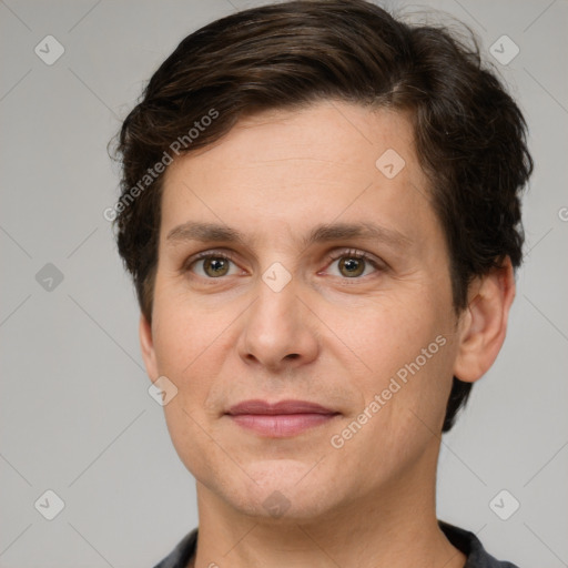 Joyful white adult male with short  brown hair and grey eyes