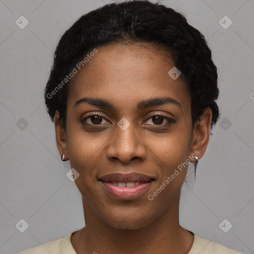 Joyful black young-adult female with short  black hair and brown eyes