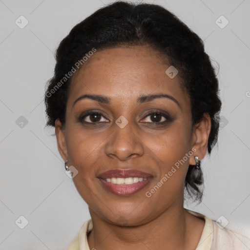 Joyful black adult female with short  brown hair and brown eyes