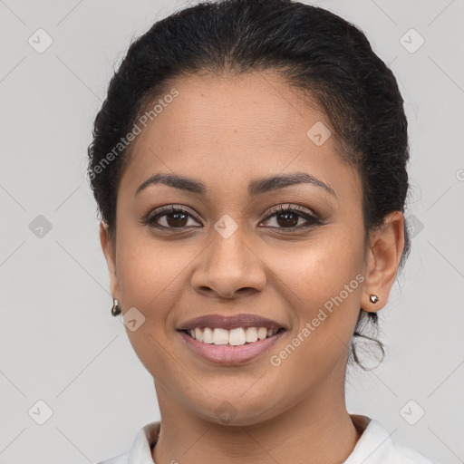 Joyful latino young-adult female with medium  brown hair and brown eyes