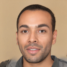 Joyful white young-adult male with short  black hair and brown eyes