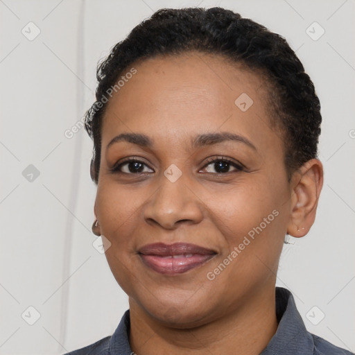 Joyful latino young-adult female with short  black hair and brown eyes