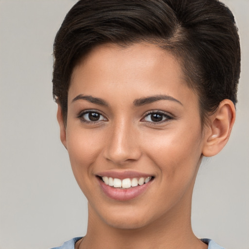 Joyful white young-adult female with short  brown hair and brown eyes