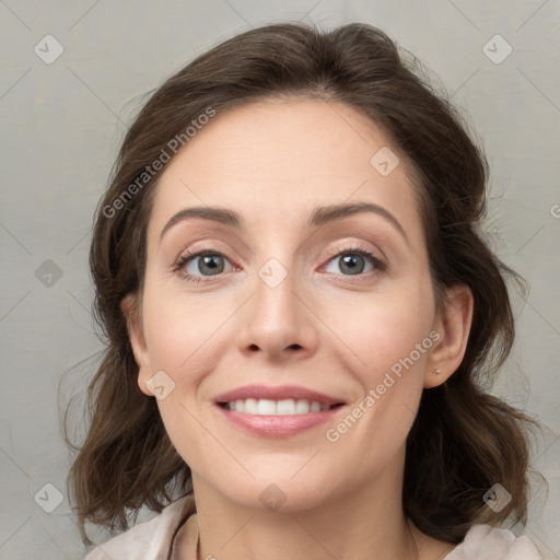 Joyful white young-adult female with medium  brown hair and grey eyes