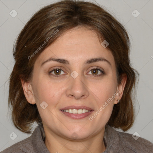 Joyful white adult female with medium  brown hair and blue eyes