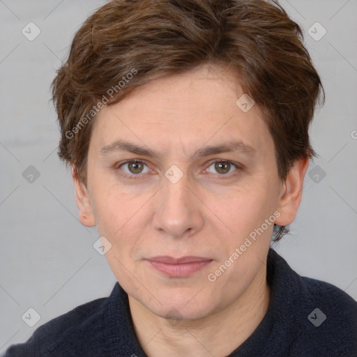 Joyful white adult female with short  brown hair and brown eyes