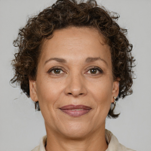 Joyful white adult female with short  brown hair and brown eyes