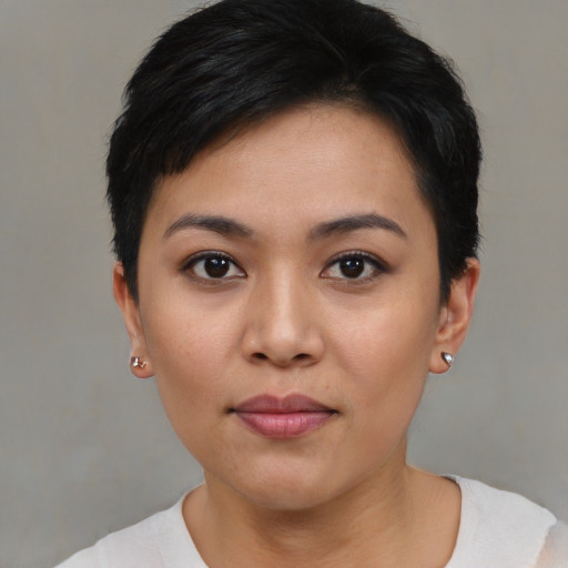 Joyful asian young-adult female with short  black hair and brown eyes