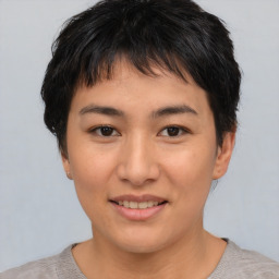 Joyful asian young-adult female with short  brown hair and brown eyes