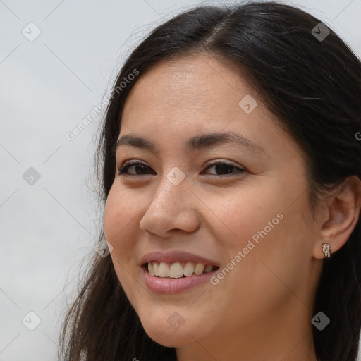 Joyful white young-adult female with long  brown hair and brown eyes