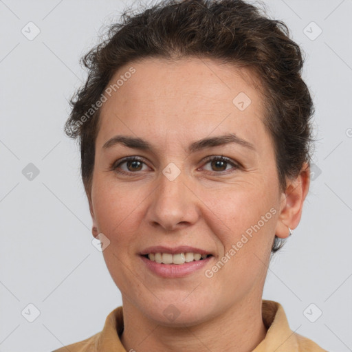 Joyful white adult female with short  brown hair and brown eyes