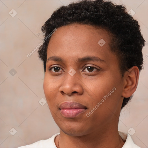 Joyful black young-adult male with short  brown hair and brown eyes