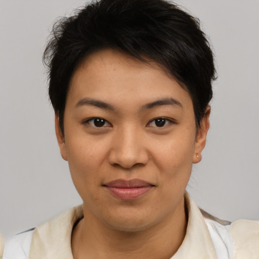 Joyful asian young-adult female with short  brown hair and brown eyes