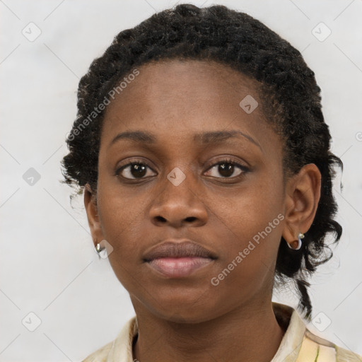 Neutral black young-adult female with short  brown hair and brown eyes