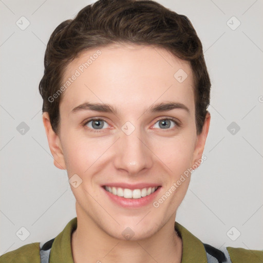 Joyful white young-adult female with short  brown hair and grey eyes