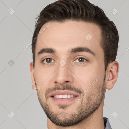 Joyful white young-adult male with short  brown hair and brown eyes