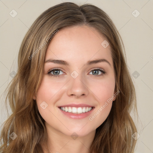 Joyful white young-adult female with long  brown hair and green eyes