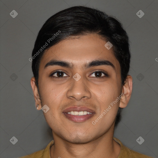 Joyful latino young-adult male with short  brown hair and brown eyes