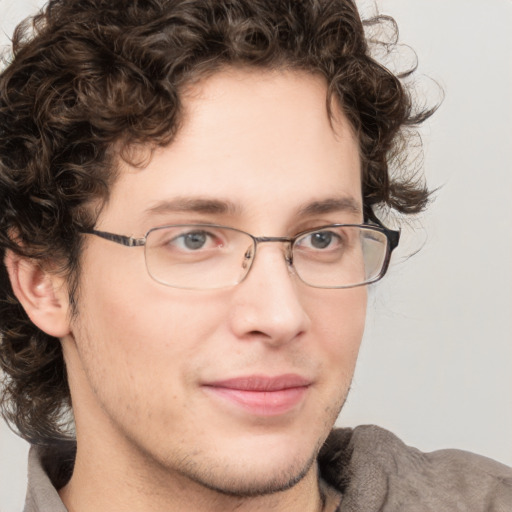 Joyful white young-adult male with medium  brown hair and brown eyes