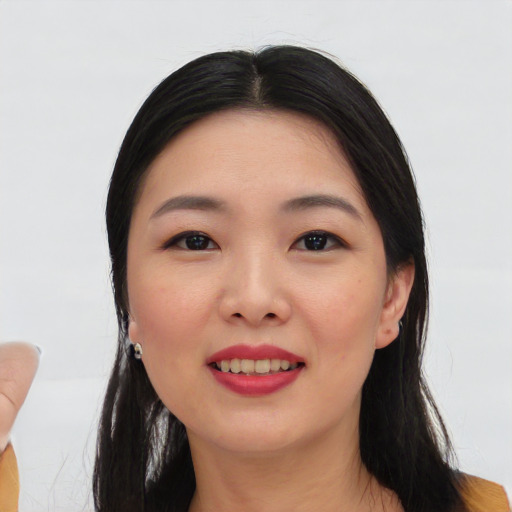 Joyful asian young-adult female with medium  black hair and brown eyes
