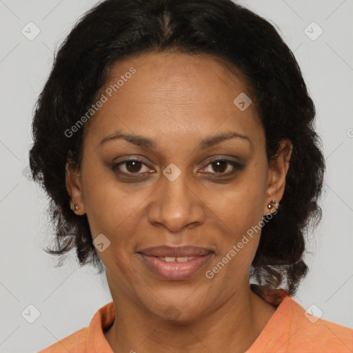 Joyful black adult female with medium  brown hair and brown eyes