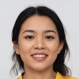 Joyful asian young-adult female with medium  brown hair and brown eyes