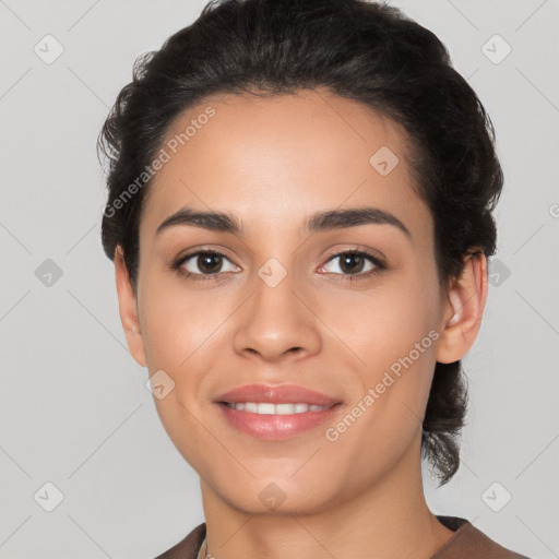 Joyful latino young-adult female with short  black hair and brown eyes