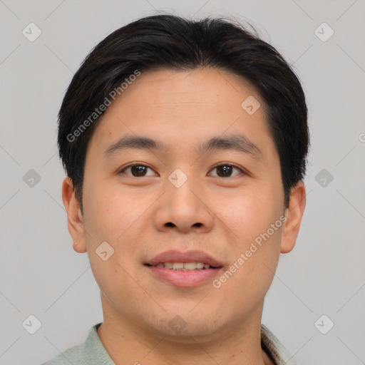 Joyful asian young-adult male with short  brown hair and brown eyes