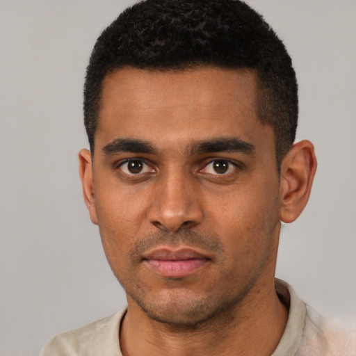 Neutral black young-adult male with short  black hair and brown eyes
