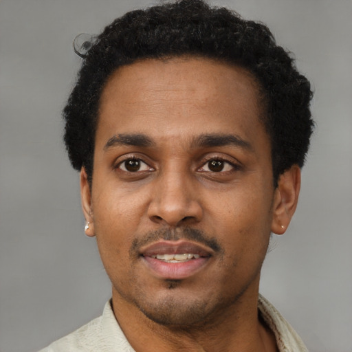 Neutral latino adult male with short  black hair and brown eyes