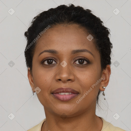 Joyful black young-adult female with short  brown hair and brown eyes