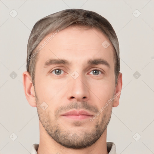 Neutral white young-adult male with short  brown hair and grey eyes