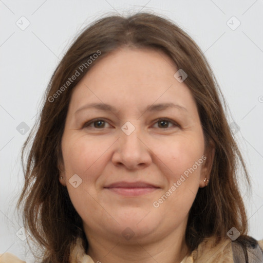 Joyful white adult female with medium  brown hair and brown eyes