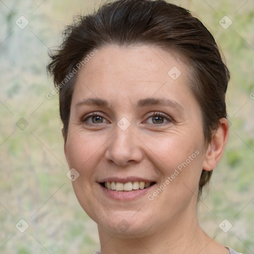 Joyful white adult female with short  brown hair and brown eyes